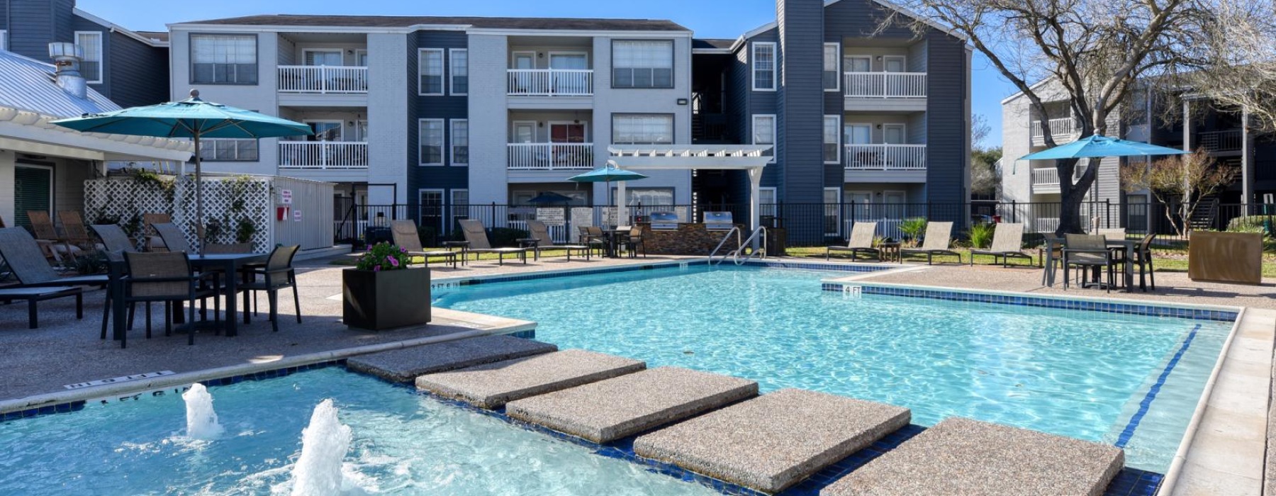 a swimming pool in front of a building
