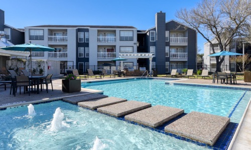 a swimming pool in front of a building