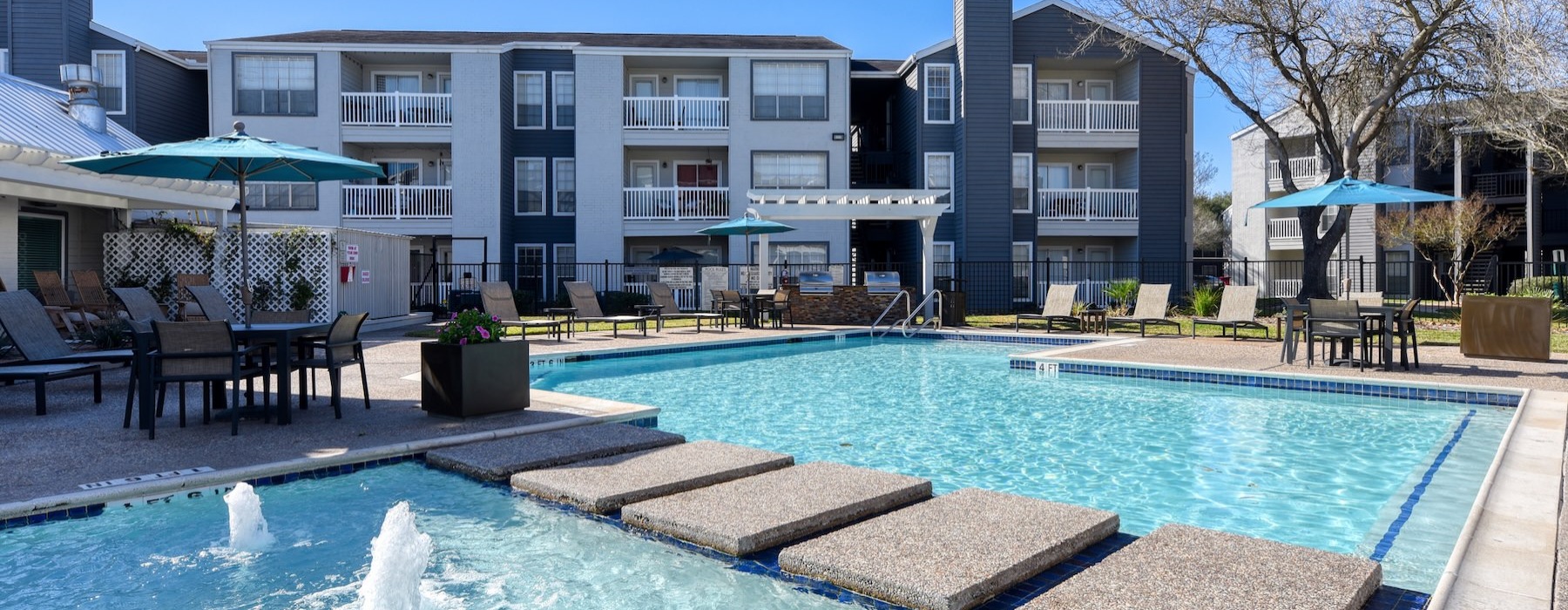 a swimming pool in front of a building