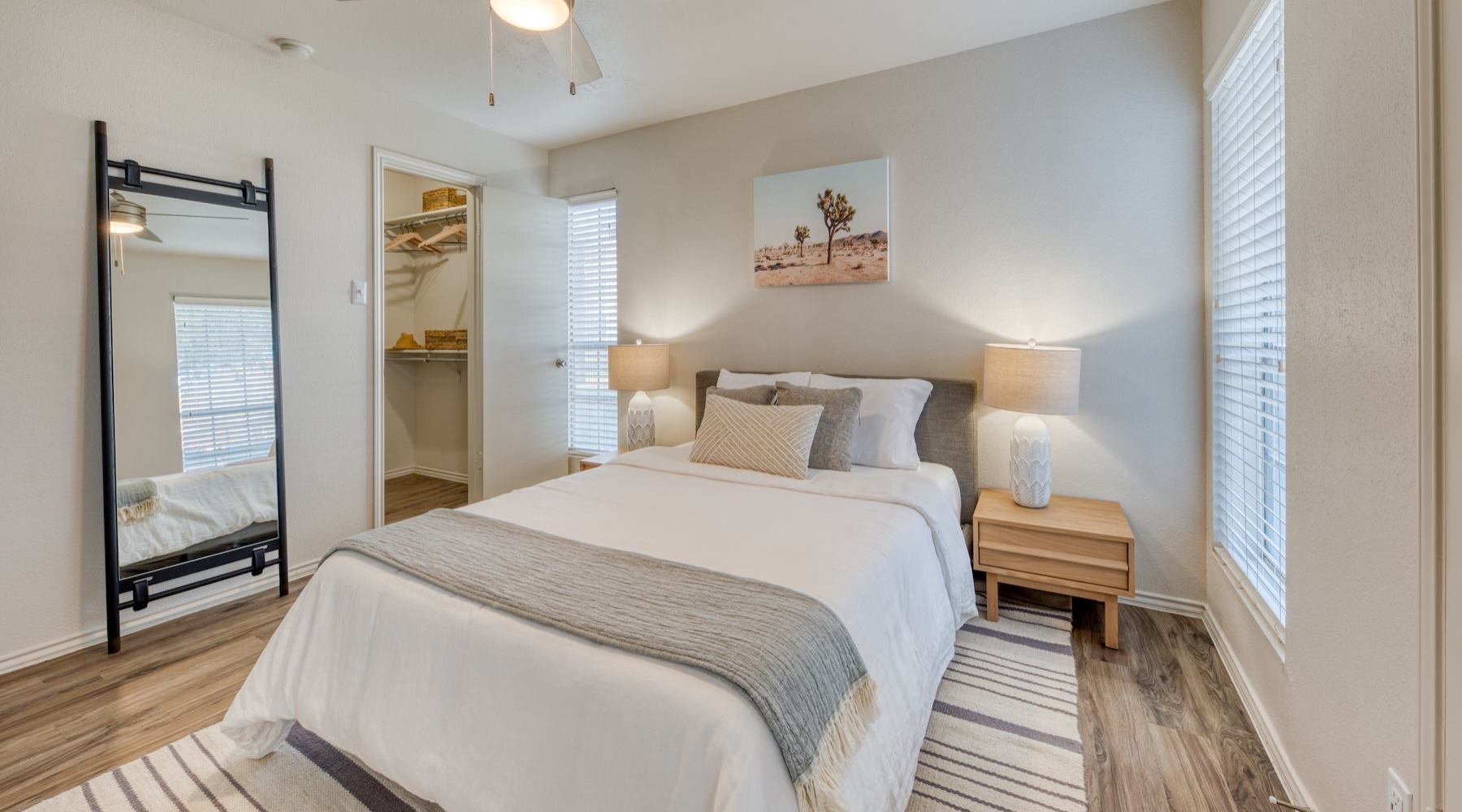 a bedroom with a bed and two nightstands